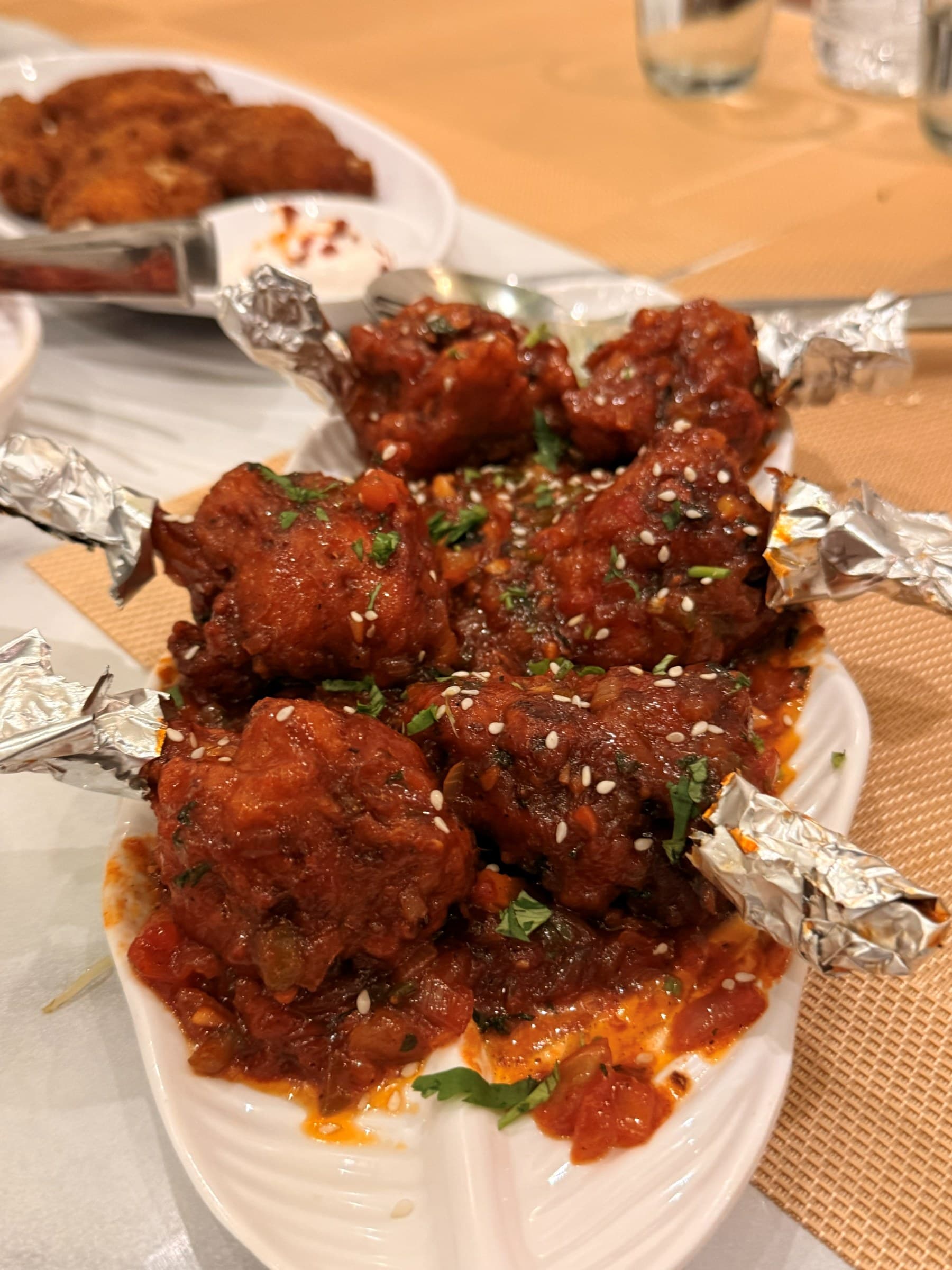 Drums of heaven glazed in a glossy chilli sauce, finished with sesame